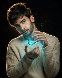 Cinematic Portrait of Man in Knit Sweater with Glowing Turquoise Butterfly