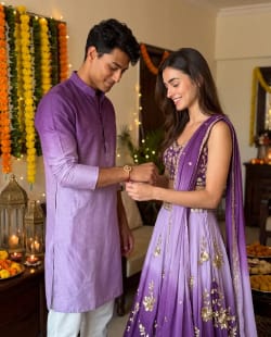 Indian Brother and Sister Celebrating Raksha Bandhan in Festive Home Interior