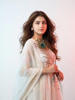 Cinematic Studio Portrait of Radha Inspired Woman with Peacock Feather
