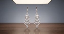 Luxury Diamond Drop Earrings Standing on Polished Walnut Wood