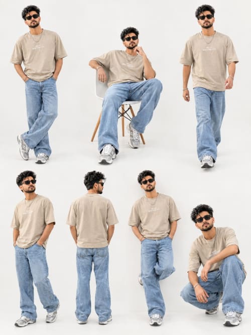 Young Man in Beige Oversized T-Shirt and Blue Jeans Streetwear Studio Lookbook