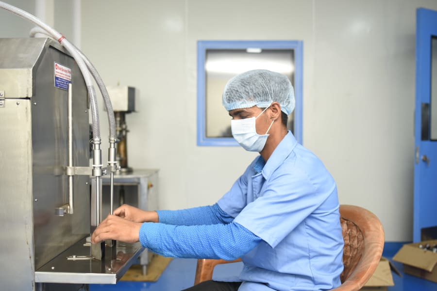 Worker at filling machine