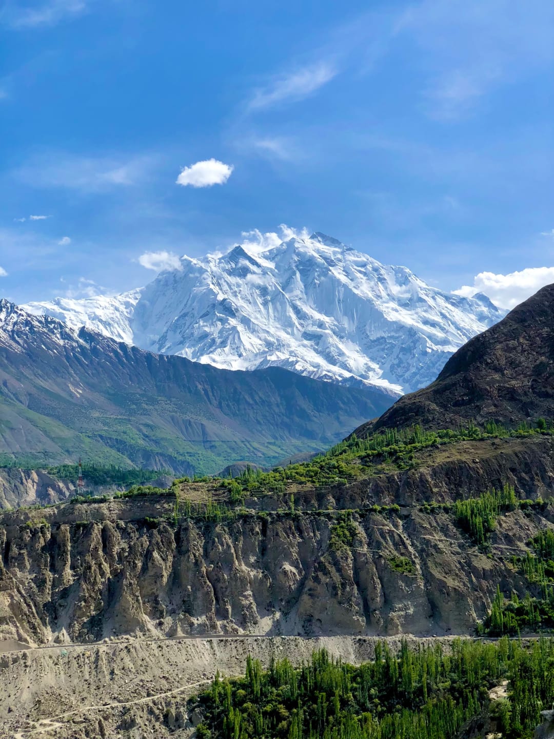 Beautiful Nagar Valley with green fields, river and snow-capped mountains in Gilgit-Baltistan Pakistan