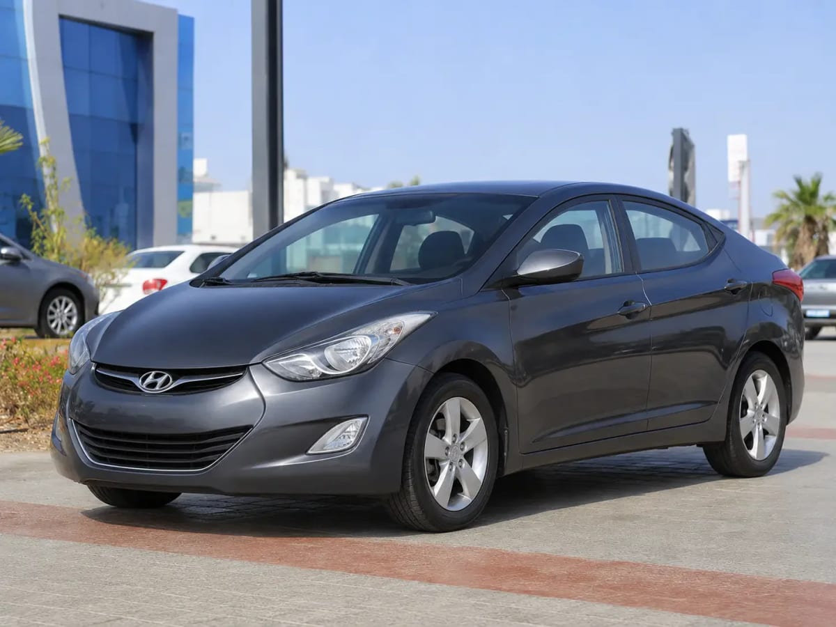 Front three-quarter view of the gunmetal Hyundai Avante 2013 available from OnTime Sharm car rental