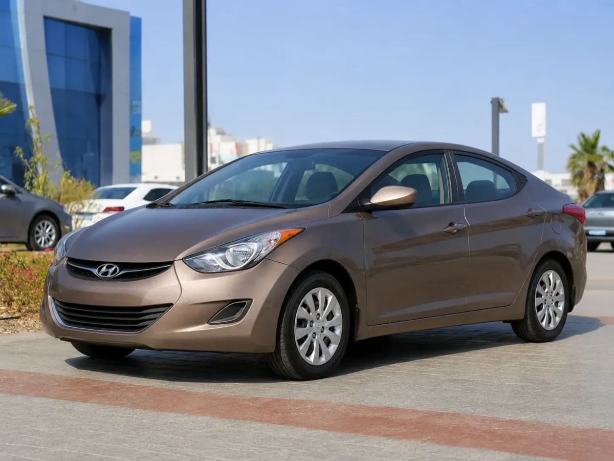 Front three-quarter view of the bronze Hyundai MD 2013 available from OnTime Sharm car rental