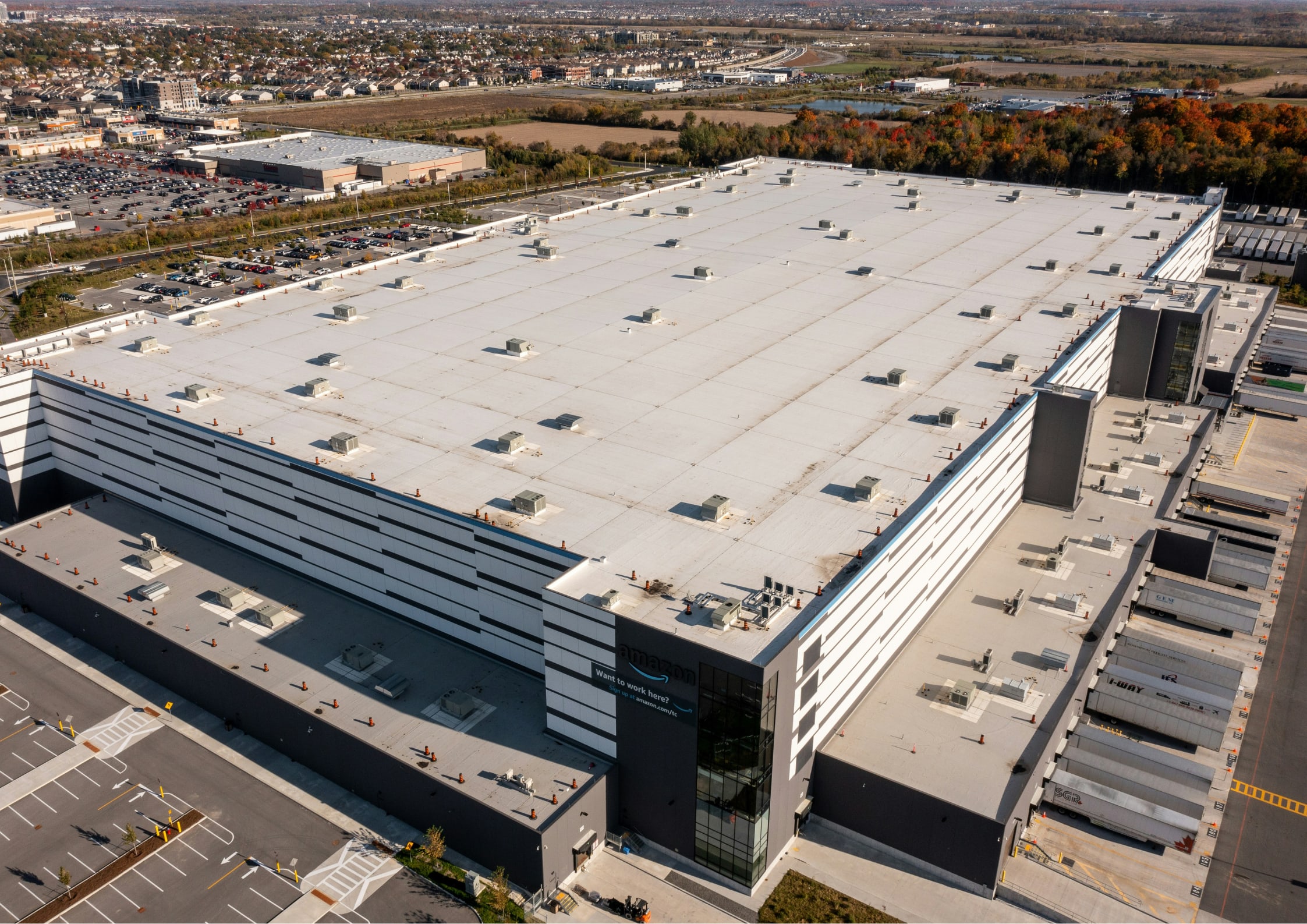 Aerial shot of amazon warehouse in the middle of a field
