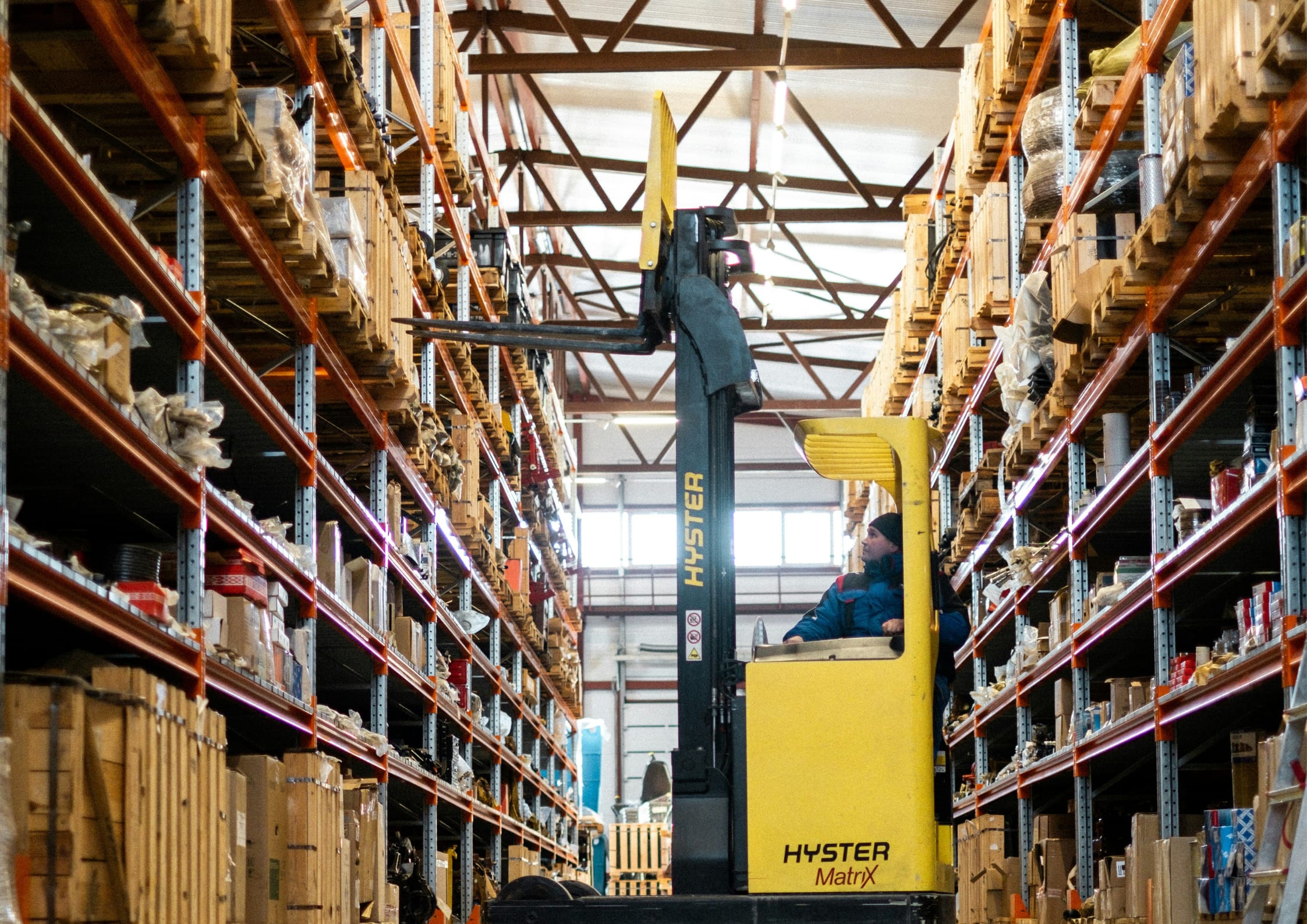 Side shot of icu forklift grabbing load