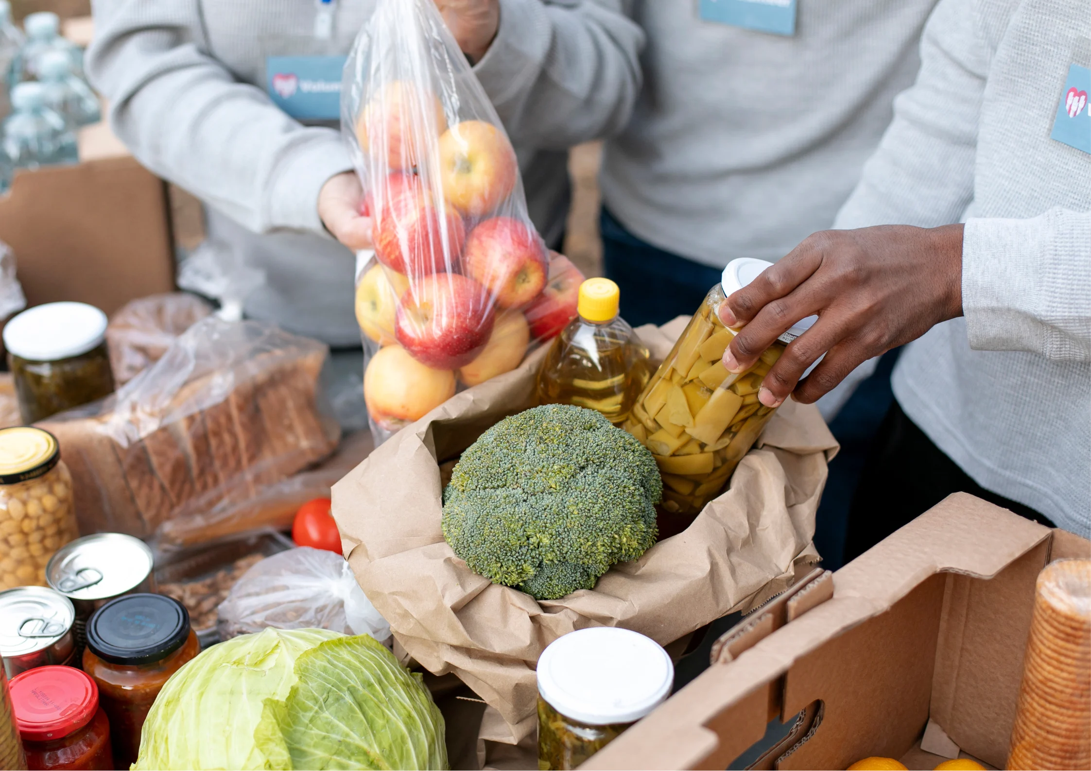 image of different people packing up the perishables they got from the market