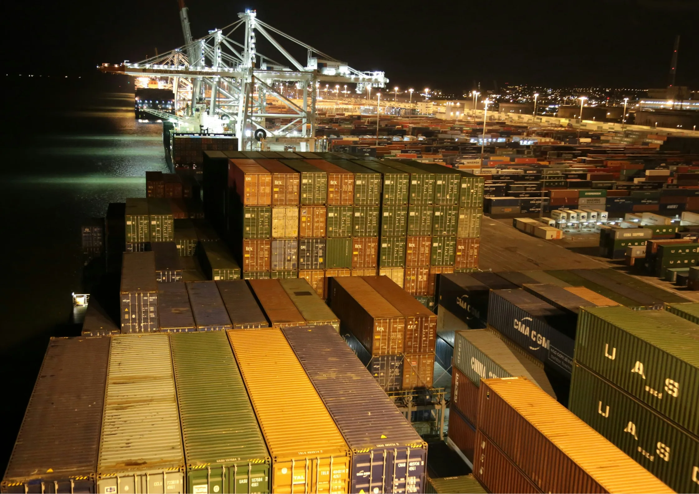 Shipping containers on a ship approaching a port of entry