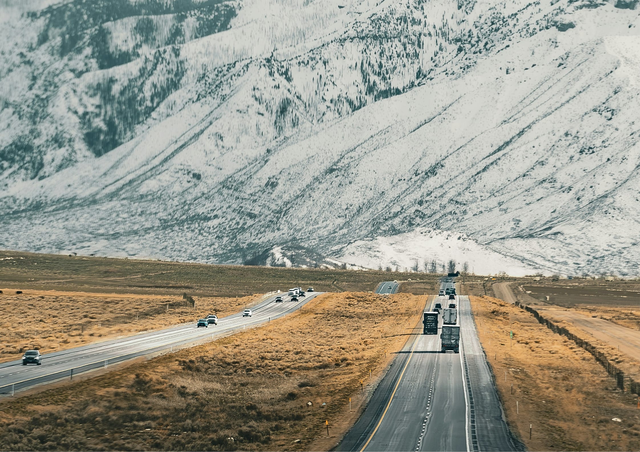 Highway shot of Utah with mountains in background