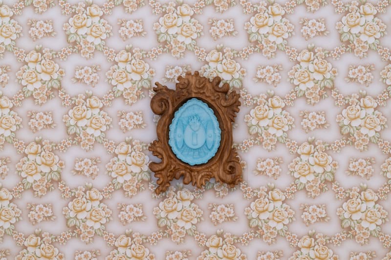 blue and wooden artwork on wall