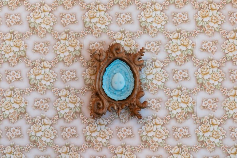 blue and wooden artwork on wall