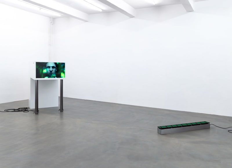 installation shot of n∰menon, left to right: large white sculpture with screen, LED Matrix on the floor