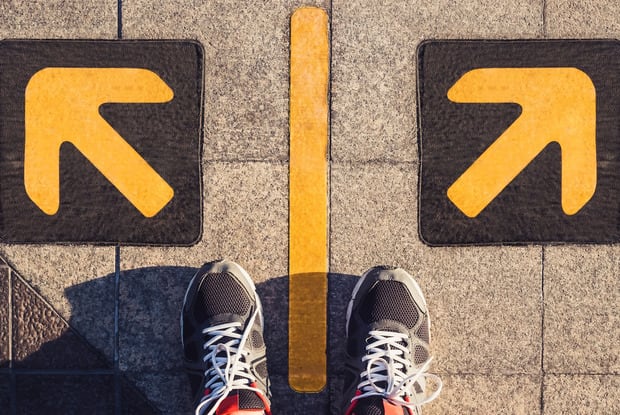 a person standing on road sign