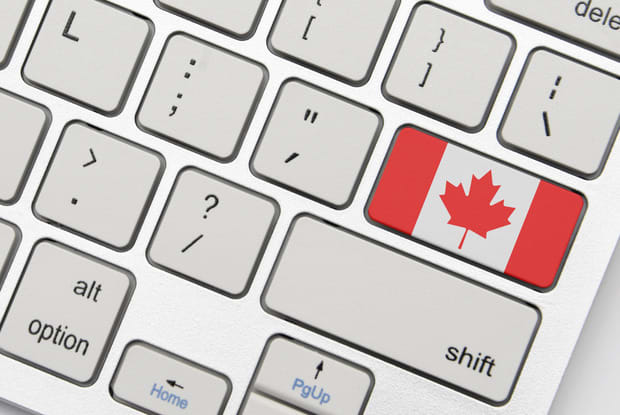 a canadian flag on a keyboard