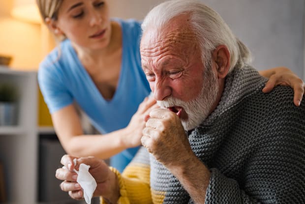 a man coughing