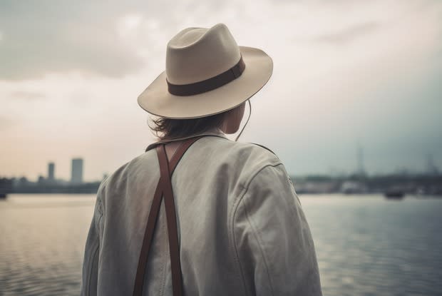 a man looking out over a body of water