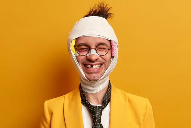 a smiling injured man 