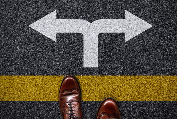 a person standing on a road sign