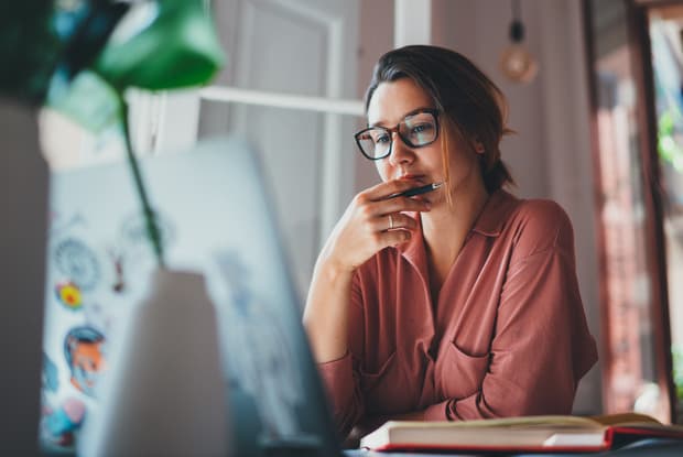 a woman reading a blog post on a computer