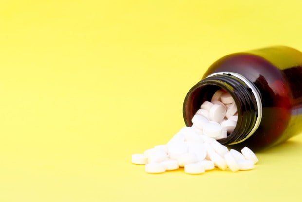 pills coming out of a bottle