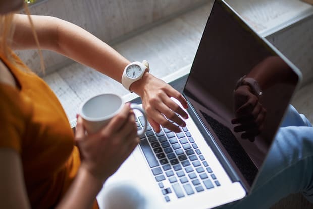 a woman checking her wristwatch