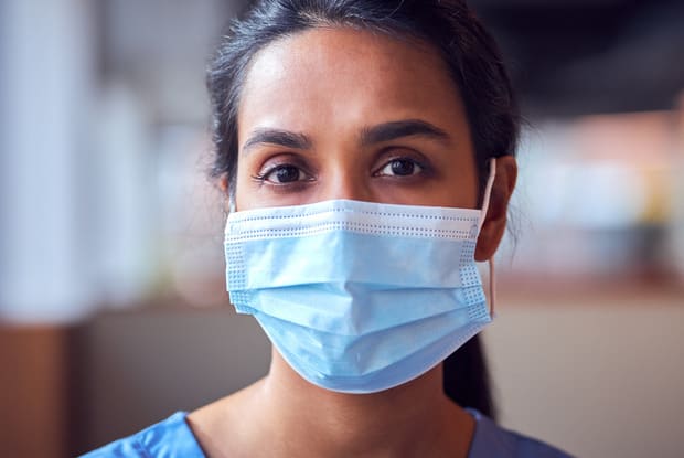 a surgeon wearing a mask