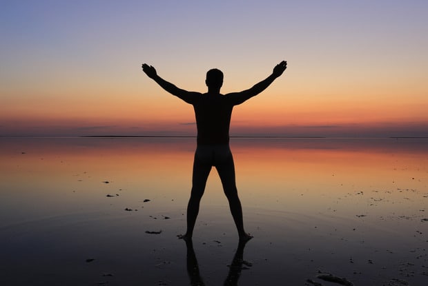 a man standing on the beach