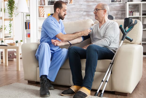 man having his blood pressure read