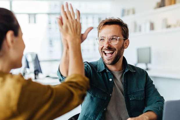 man high fiving a woman