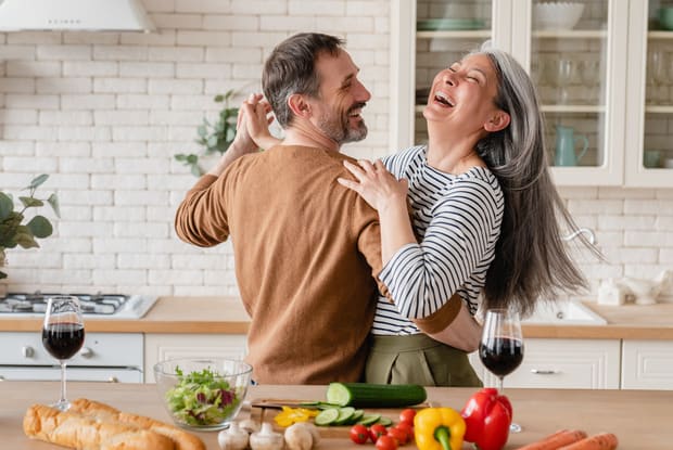 a couple hugging in kitchen