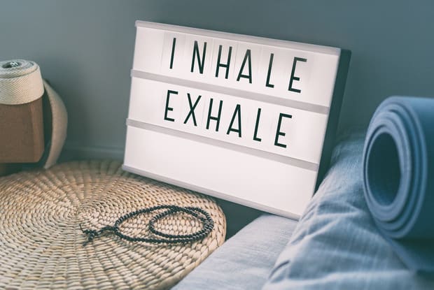 a sign that says inhale and exhale