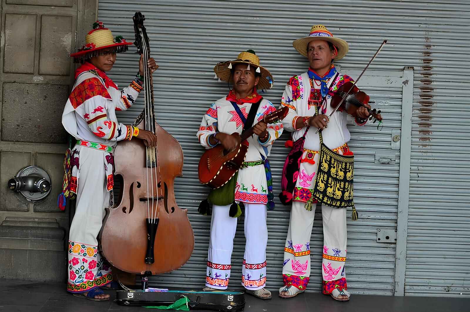 3 Huichol men dressed in traditional mexican clothing
