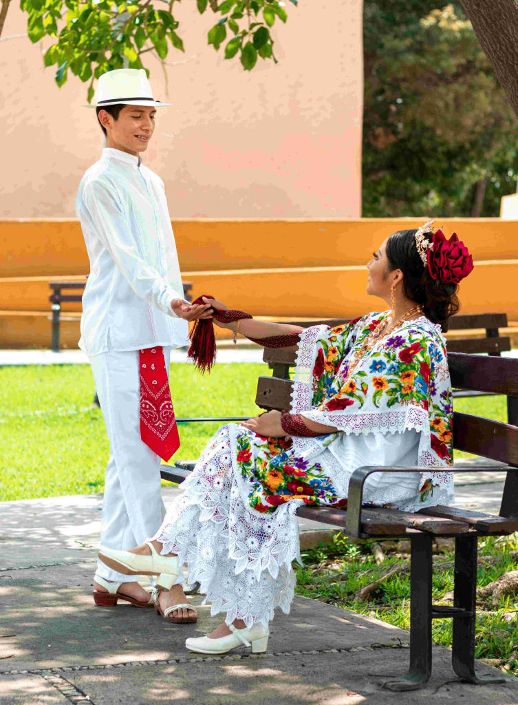Men and woman dressed in Guayabera and Terno from Yucatan