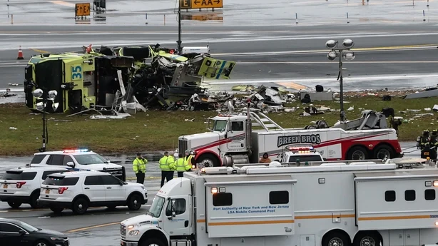 Damaged Airport Rescue and Firefighting (ARFF) truck at the intersection of Runway 04 and Taxiway E at LaGuardia Airport, following ground collision with Air Canada CRJ-900