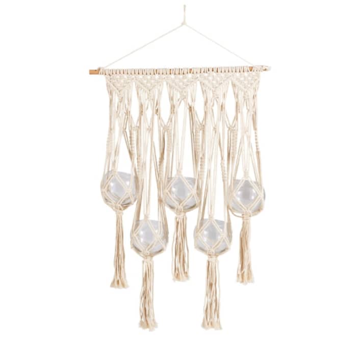 Hanging macramé with glass vases.