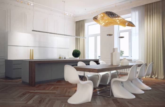 White Panton chairs around a contemporary wood and metal table.