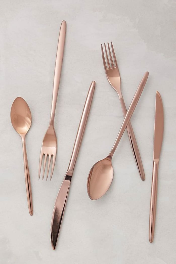 Minimalist cutlery set in rose-pink; Doma by Anthropologie. Minimalist cutlery set in rose-pink; Doma by Anthropologie.