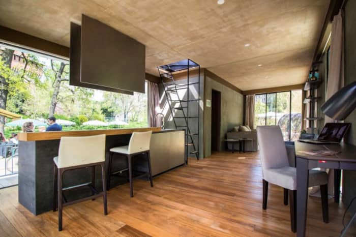 The interior of Genesi House, an example of sustainable living and energy efficiency. View of the kitchen and dining areas. The interior of Genesi House, an example of sustainable living and energy efficiency. View of the kitchen and dining areas.