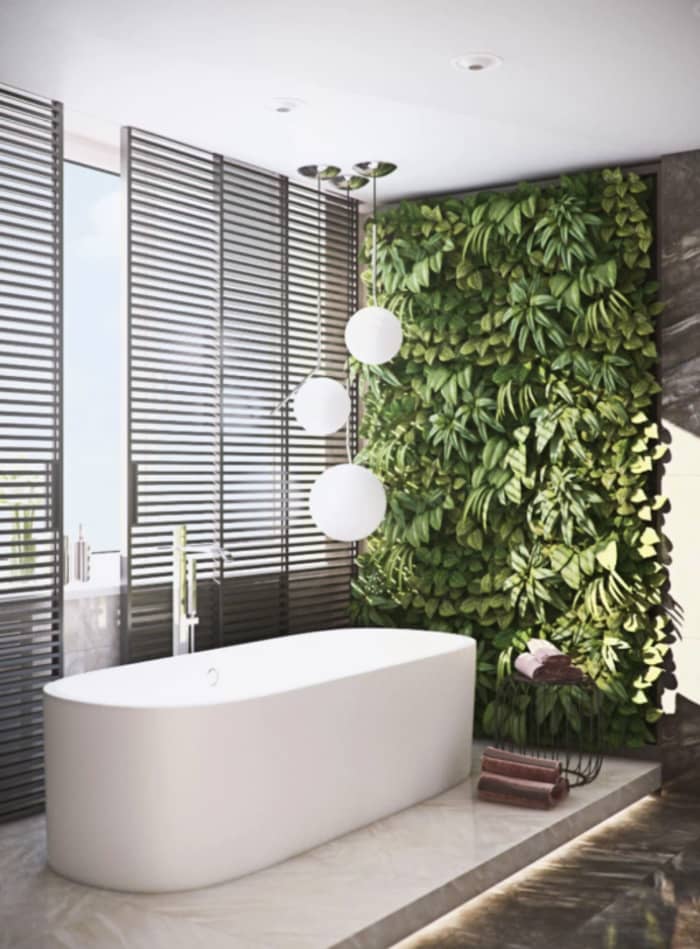 Modern bathroom with a garden wall design next to the bathtub. Modern bathroom with a garden wall design next to the bathtub.