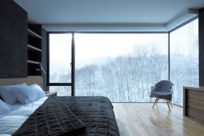 Bedroom with winter outside view, great example of biophilic design. Bedroom with winter outside view, great example of biophilic design.