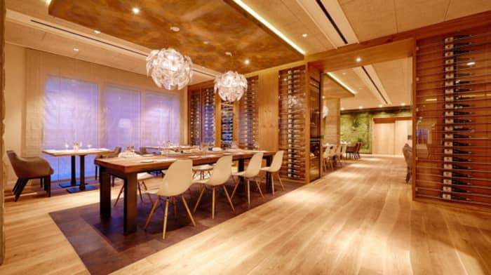 Modern restaurant design with clear wood curved flooring.