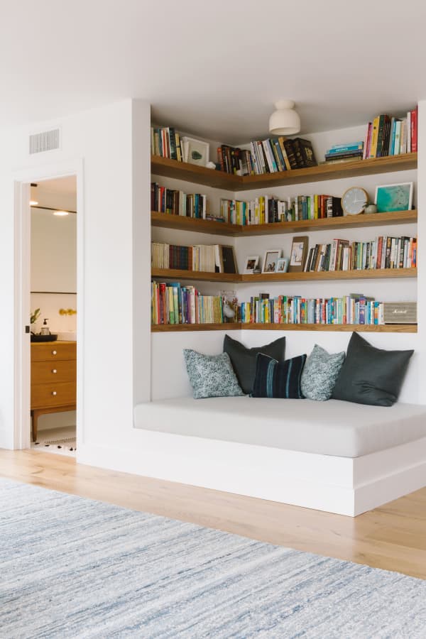 Reading nook in a modern living room, great option to create a refuge area in a biophilic design.