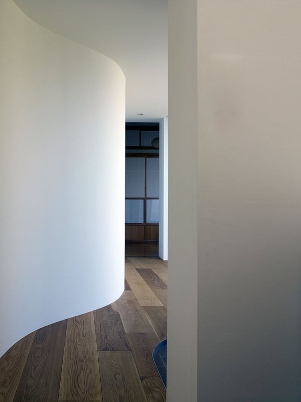 Curved shape corridor, great option to create a misterious path in a biophilic design.