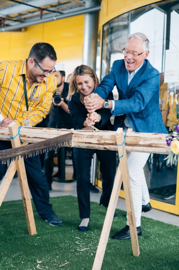 Cutting a branch of wood at IKEA's Aubonne inauguration in September 2017.