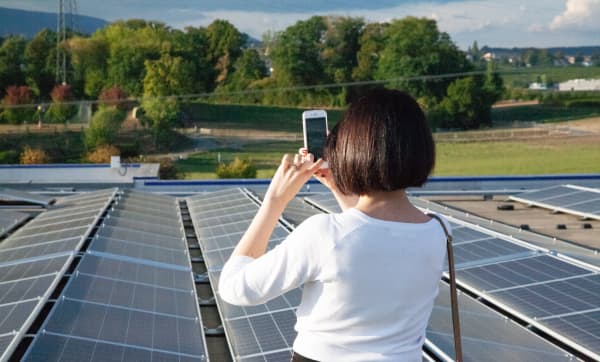 Me taking a photo of solar panels on the roof of IKEA's Aubonne, a champion store for sustainability.