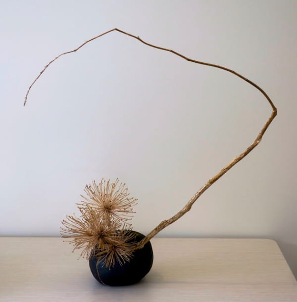 Ikebana arrangement of dried branches, perfect décor in a minimalist interior.