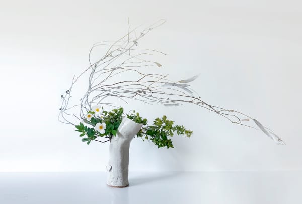 Ikebana arrangement with highly bended stems.