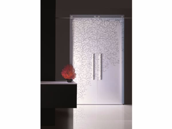 Sliding door with a coral patter impressed, great example of biophilic design.