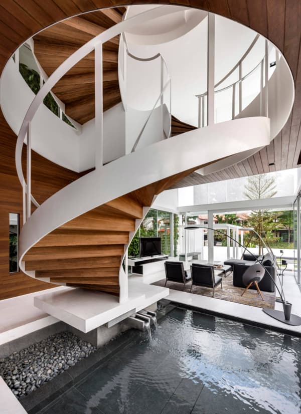 Pond below a modern staircase.